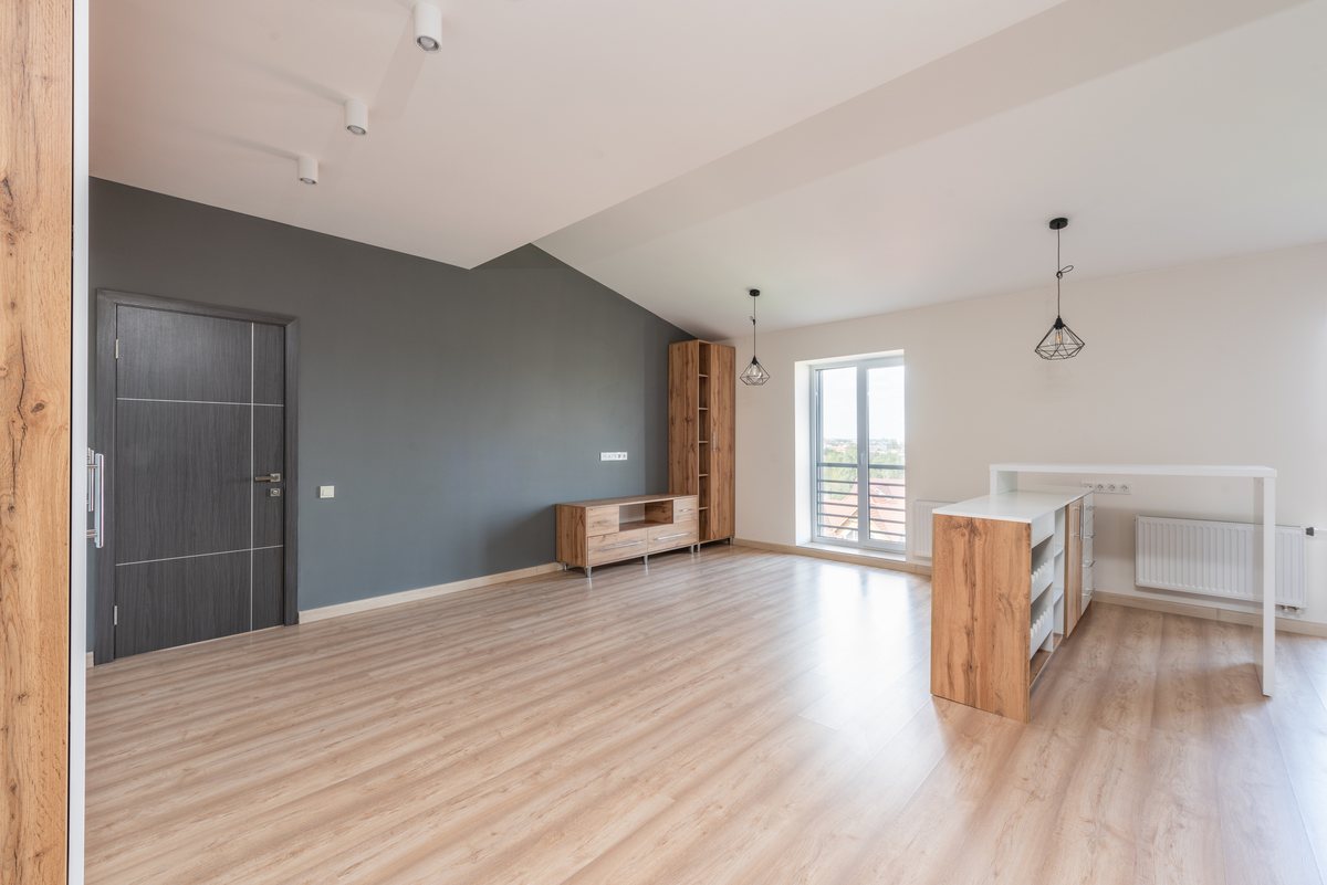 LVT Click 5.0 mm wood-look floor in a living room (catalogue image)